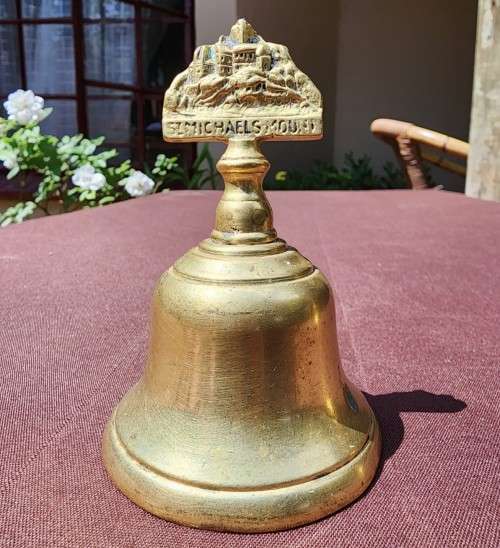Brass TWO VINTAGE BRASS BELLS AN OLD SCHOOL BELL AND A ST MICHAELS MOUNT BELL for sale in